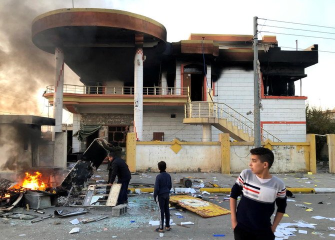 The headquarters of the Kurdistan Democratic Party (PDK) after it was set on fire during anti-government protests on the outskirts of Sulaimaniyah, Iraq, December 8, 2020. (Reuters)