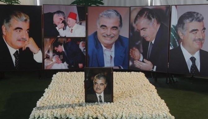 Pictures of Lebanon's assassinated former prime minister Rafik al-Hariri are seen at his grave site in downtown Beirut on January 16, 2014. (Reuters/file)