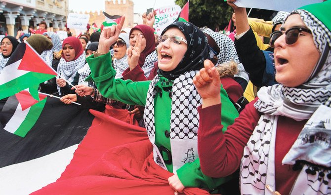 Moroccans wave the Palestinian flag during a demonstration against the US Middle East peace plan, in Rabat, Morocco. (AFP/File)