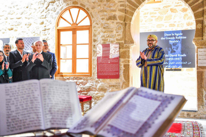 This file handout photo provided by the Moroccan Royal Palace on January 15, 2020, shows Morocco's King Mohammed VI (R) during a visit to the 