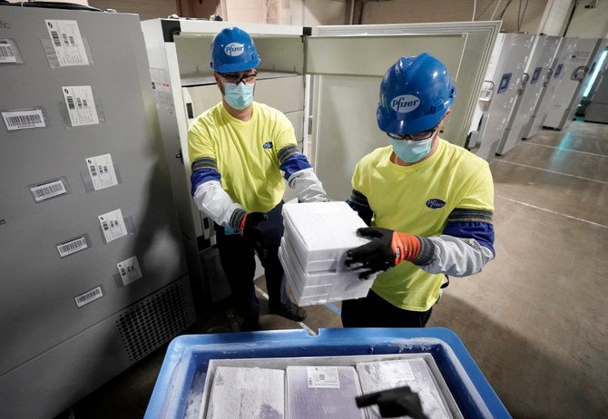 Health workers pack vaccines in dry ice prior to distribution. (AP)