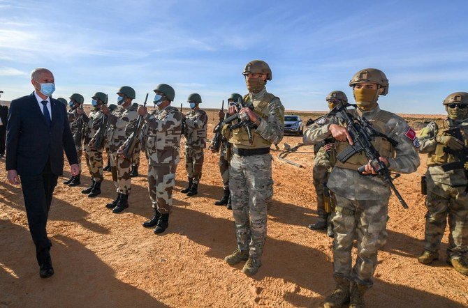 This handout picture released by the Tunisian Presidency on December 14, 2020 shows Tunisian President Kais Saied visiting Ain Sekhouna, south of Tunisia, where a land dispute between two tribes escalated. (AFP)