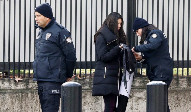 Policemen search a woman in Ankara, in this file photo taken on March 5, 2018. (AFP)