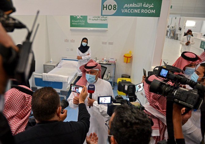The first Saudi citizen receiving the Pfizer-BioNTech COVID-19 coronavirus vaccine (Tozinameran) speaks to reporters after its administration at a vaccination centre supervised by the health ministry in the capital Riyadh on December 17, 2020. (File/AFP)