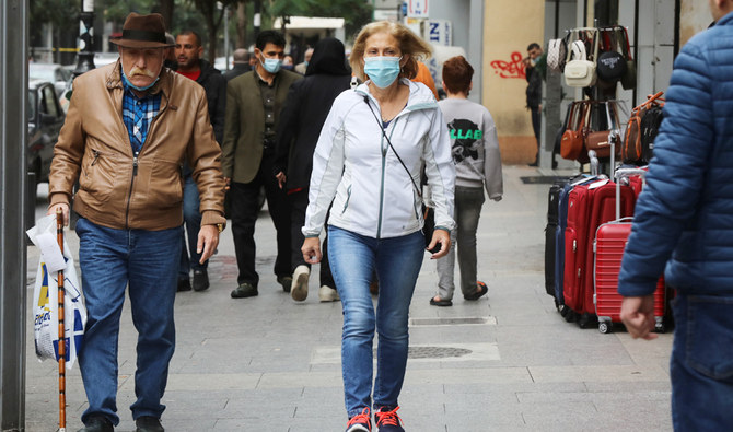 People wear face masks as they walk along a street in Beirut, Lebanon December 15, 2020. (REUTERS)