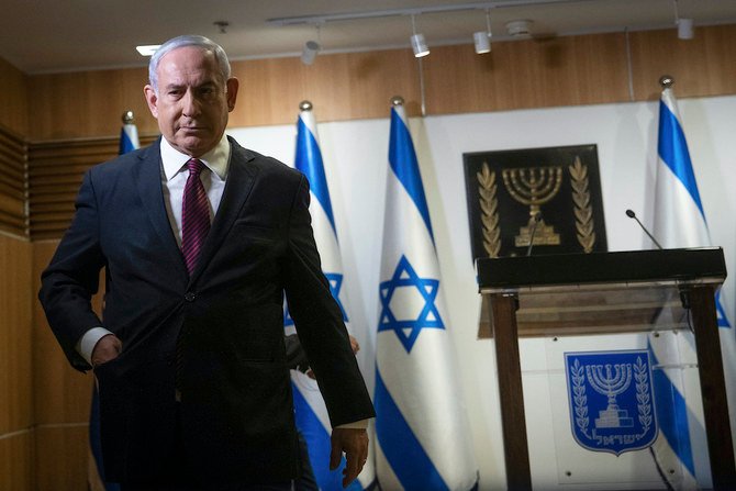 Israeli Prime Minister Benjamin Netanyahu delivered a statement at the Israeli Knesset, or Parliament, in Jerusalem, Tuesday, Dec. 22, 2020. Netanyahu said, “We did not want elections, but we will win.” (Pool Photo via AP)