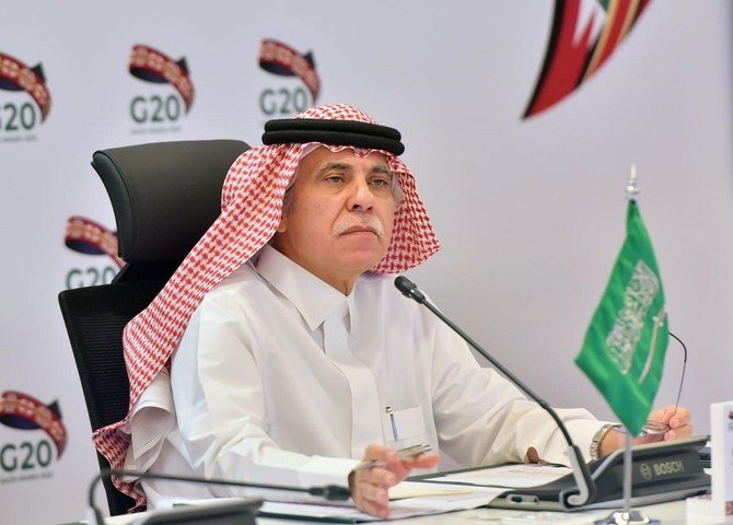 This handout picture provided by G20 summit's Press Office shows Saudi Minister of Commerce Majid al-Qasabi reaffirming the G20 leaders' 