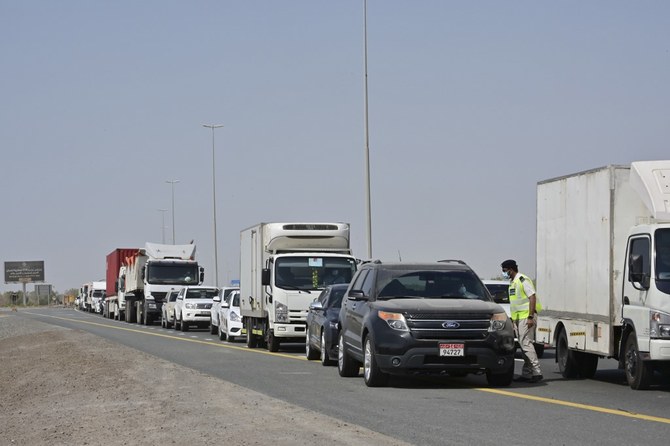 Emirati security forces man a checkpoint at the entrance of Abu Dhabi, on the highway linking Dubai to the capital, on June 2, 2020. (File/AFP)