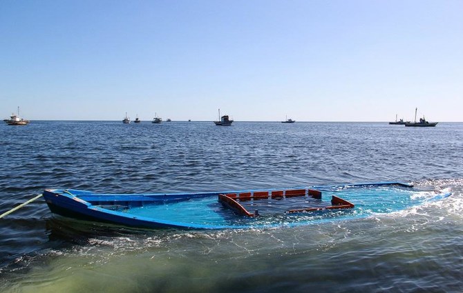 A picture taken on October 13, 2020, shows a boat, which was carrying 29 people and sank off the Tunisian coast, being towed near the Tunisian coastal town of Amra. (File/AFP)