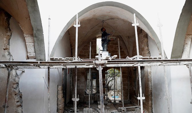 A worker renovates the long-abandoned 200-year-old Ghussein palace, in the old quarter of Gaza City, Monday, Dec. 14, 2020. (AP)