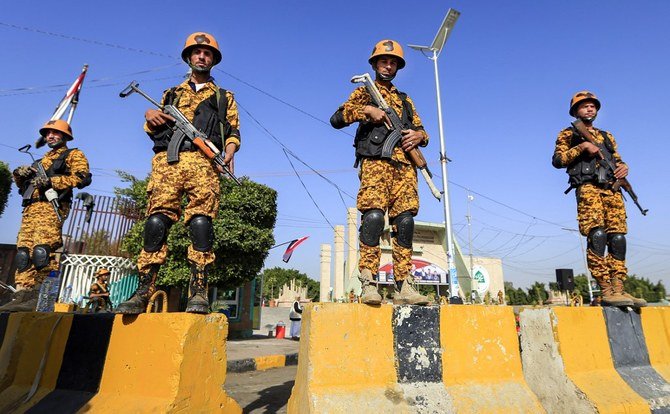 Security forces loyal to the Houthi rebels stand on guard duty during a mass wedding in Sanaa on Dec. 9, 2020. (File/AFP)