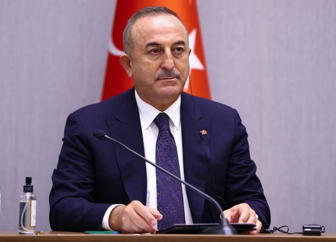 A handout photograph taken and released on Decю 29, 2020 by the Russian Foreign Ministry shows Turkish Foreign Minister Mevlut Cavusoglu attending a press conference in Sochi. (File/AFP)
