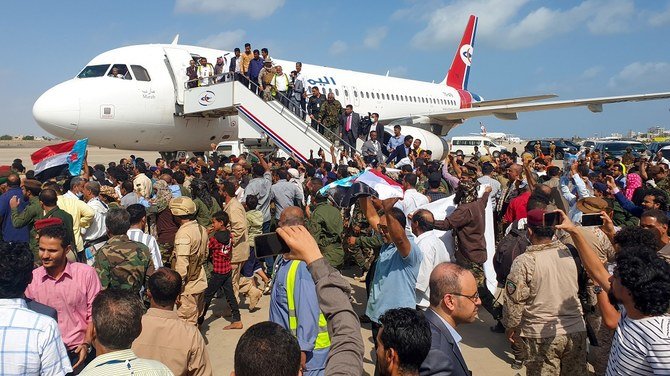 Crowds gathered on the runway as the passengers started to come off. (AFP)
