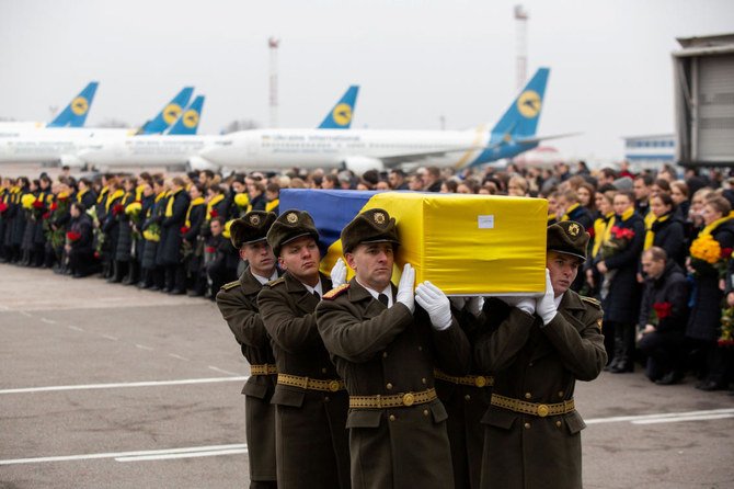 Soldiers carry a coffin containing the remains of one of the eleven Ukrainian victims of the Ukraine International Airlines flight 752 plane disaster during a memorial ceremony at the Boryspil International Airport, outside Kiev, Ukraine January 19, 2020. (File/Reuters)