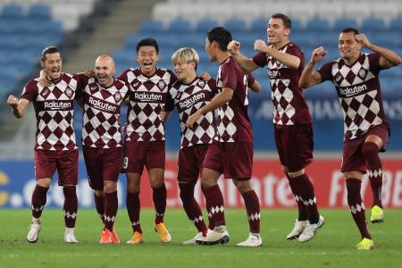 Kobe's players celebrate after winning the AFC Champions League quarter-final match against Korea's Suwon Samsung Bluewings on December 10, 2020 at the Al-Janoub Stadium in the Qatari city of Al Wakrah. (AFP)