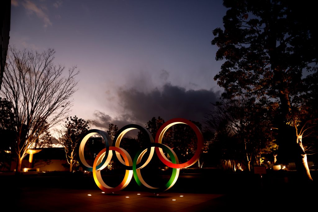 Olympic Rings are seen near the National Stadium, the main venue for the Tokyo 2020 Olympic and Paralympic Games, in Tokyo on January 8, 2021, as Tokyo Olympics organisers insisted that the coronavirus-postponed Games will still go ahead despite Japan declaring a state of emergency less than 200 days before the opening ceremony. (AFP)