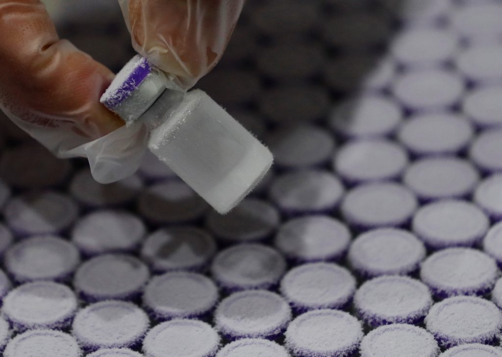 A staff member takes out a vial containing water from a pharmaceutical refrigerator during a mock inoculation exercise, as Japan prepares for coronavirus disease (COVID-19) vaccination campaign, at a college gym in Kawasaki, south of Tokyo, Japan, Jan. 27, 2021. (File photo/Reuters)