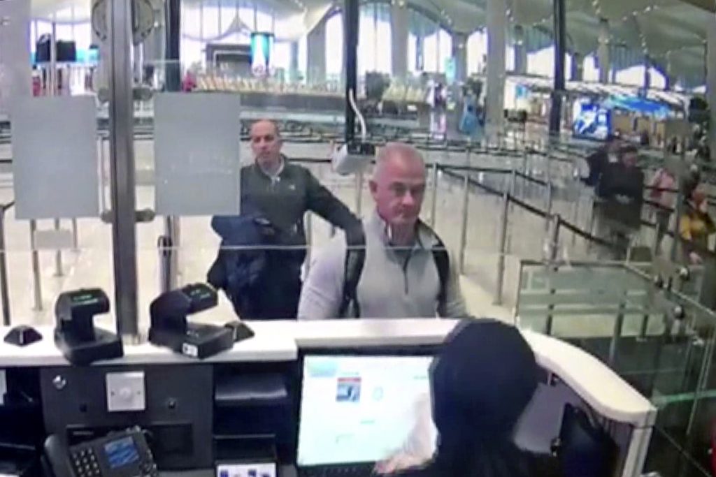 Image from security camera video shows Michael L. Taylor, center, and George-Antoine Zayek at passport control at Istanbul Airport in Turkey. 