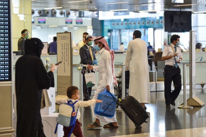 Saudi passengers arrive King Fahad International Airport in the capital Riyadh on May 31, 2020. (AFP/File)