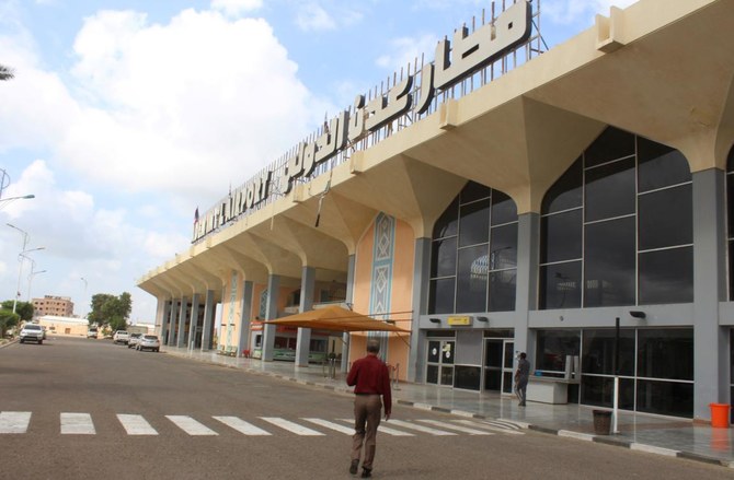 A man walks to the airport building in Yemen's city of Aden on January 3, 2021, as activity resumes after explosions rocked the building on December 30, killing or injuring dozens of people. (AFP)
