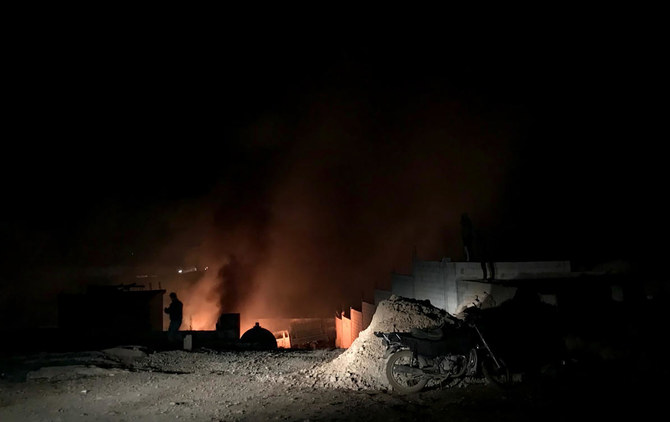 Fire and smoke plumes rise at the scene of an explosion in the Lebanese Hermel governorate in the eastern Bekaa valley, near the Syrian border, on January 3, 2021. (AFP)