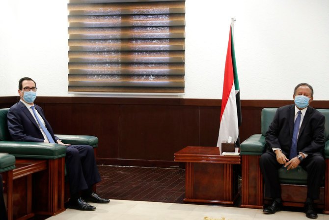 Sudanese Prime Minister Abdullah Hamdok, right, meets with US Treasury Secretary Steven Mnuchin in the Cabinet Building, in Khartoum, Sudan, Wednesday, Jan. 6, 2021. (AP)