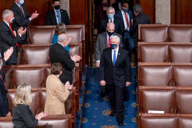 Vice President Mike Pence and Senate Majority Leader Mitch McConnell, top center, arrive at the Capitol in Washington, D.C. for a joint session of the House and Senate convenes to confirm the electoral votes cast in November's election. (AP Photo/Andrew Harnik)