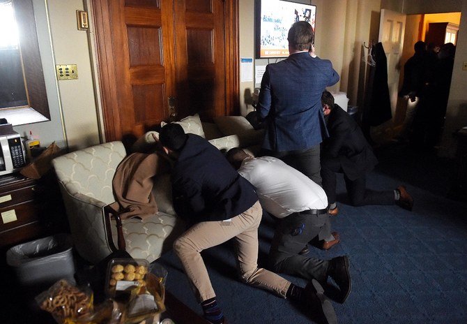 Congress staffers barricaded themselves after Trump supporters stormed inside the US Capitol in Washington. (AFP)