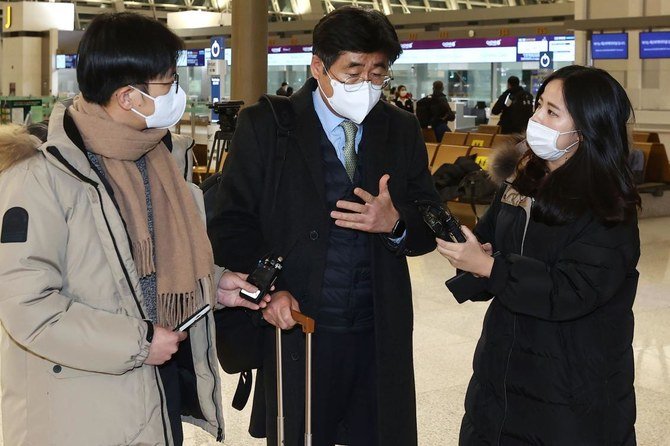 A South Korean delegation led by Koh Kyung-sok (C), director-general of the South Korean Foreign Ministry's Africa and Middle Eastern affairs, leaves for Tehran via Qatar at Incheon international airport, west of Seoul, on January 6, 2021. (AFP)