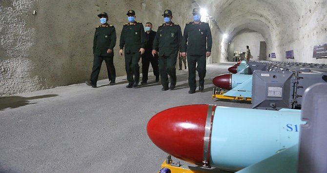 shows IRGC commander-in-chief Major General Hossein Salami alongside navy commander Admiral Alireza Tangsiri unveiling an underground base for anti-ship missiles at an undisclosed Gulf location. (AFP/ Iran's Revolutionary Guards via SEPAH News)