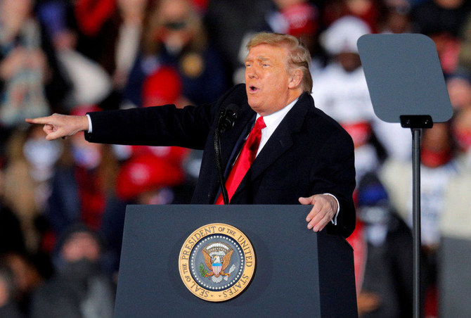 US President Donald Trump gestures while campaigning for Republican Senator Kelly Loeffler on the eve of the run-off election to decide both of Georgia's Senate seats, in Dalton, Georgia on January 4, 2021. (REUTERS/Brian Snyder/File Photo)