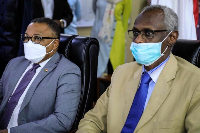 Sudan's Minister of Irrigation and Water Resources and Minister for Foreign Affairs are pictured during a video conference meeting with their Egyptian and Ethopian counterparts in Khartoum on January 10, 2020. (AFP)
