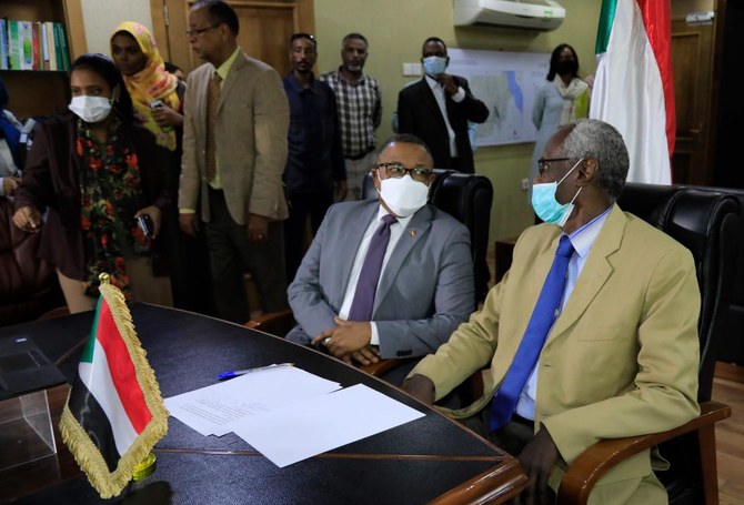 Sudan's Minister of Irrigation and Water Resources (R) and Minister for Foreign Affairs are pictured during a video conference meeting with their Egyptian and Ethopian counterparts in Khartoum on January 10, 2020. (AFP)