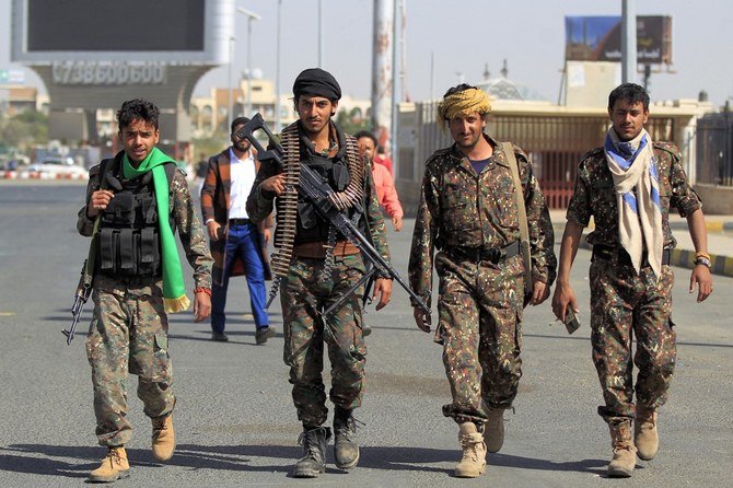 Security forces loyal to the Houthi militia walk while on duty during a mass wedding for thousands of couples on Dec. 9, 2020. (File/AFP)