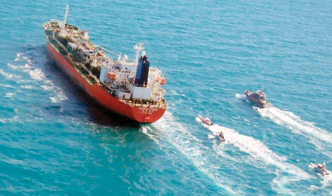 A South Korean-flagged tanker is escorted by Iranian Revolutionary Guard boats in this Jan. 4, 2021 file photo released by Tasnim News Agency. (AP)