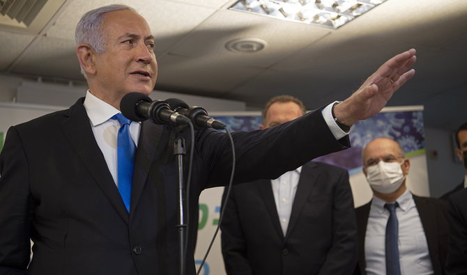 Israeli Prime Minister Benjamin Netanyahu visits a coronavirus vaccination facility in the northern Arab city of Nazareth, Israel, Wednesday, Jan. 13, 2021. (AP)