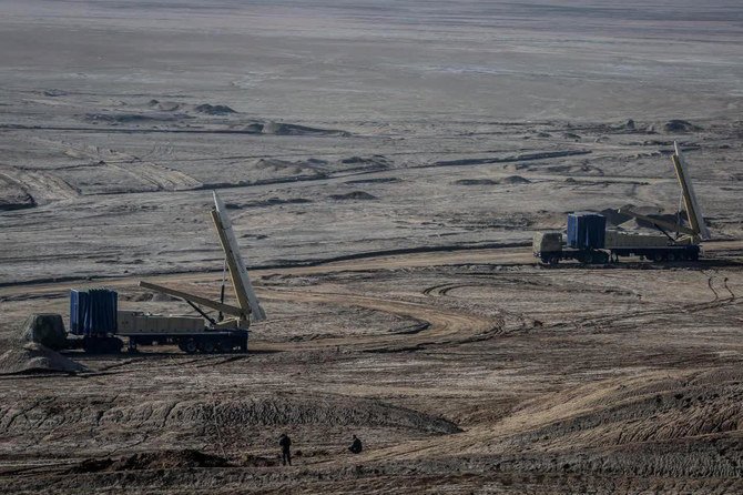 Iran’s paramilitary Revolutionary Guard forces on Friday held a military exercise involving ballistic missiles and drones in the country’s central desert, state TV reported. (Iranian Revolutionary Guard/Sepahnews via AP)