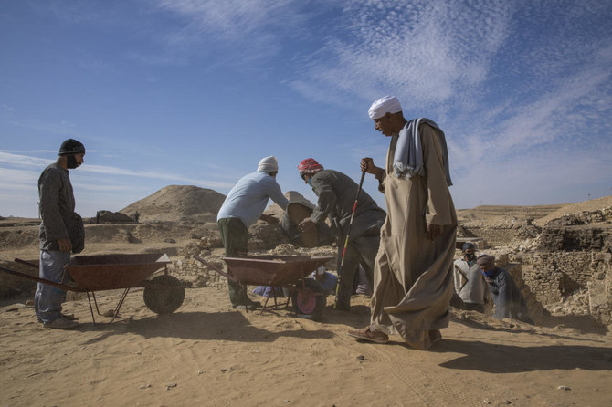 Archeologists work at the excavation site of the funerary temple of Queen Nearit in Saqqara, south of Cairo, Egypt, Sunday, Jan. 17, 2021. (AP)