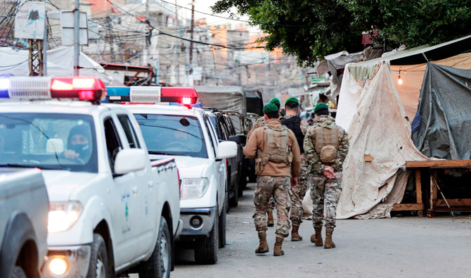 Lebanese soldiers patrol as they try to enforce a total lockdown in the southern suburbs of Beirut as a measure against the COVID-19 pandemic. (AFP)