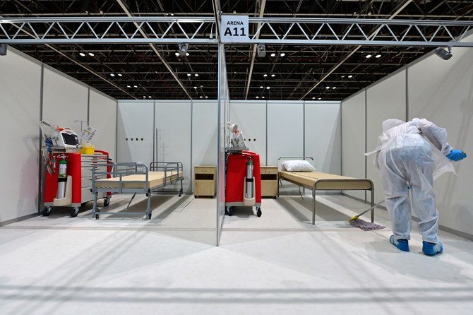 Cleaner sanitize rooms at the temporary COVID-19 hospital built in downtown Dubai in the UAE, on July 7, 2020. (File/AFP)