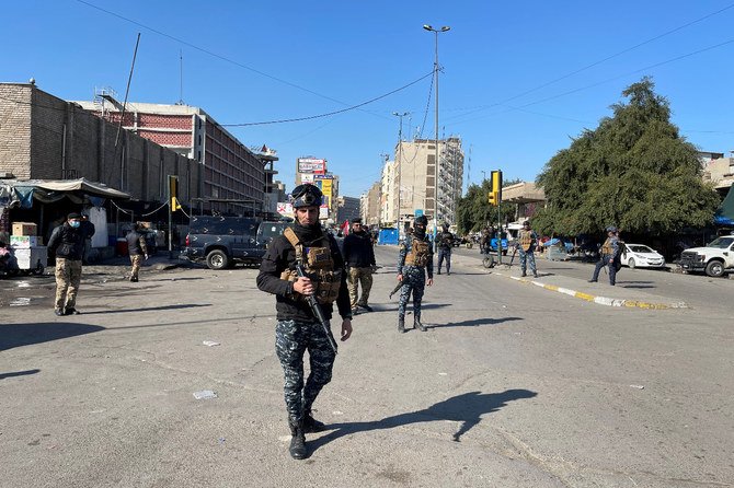 Iraqi security forces guard the site of a suicide attack in Baghdad, Iraq January 21, 2021. (Reuters)