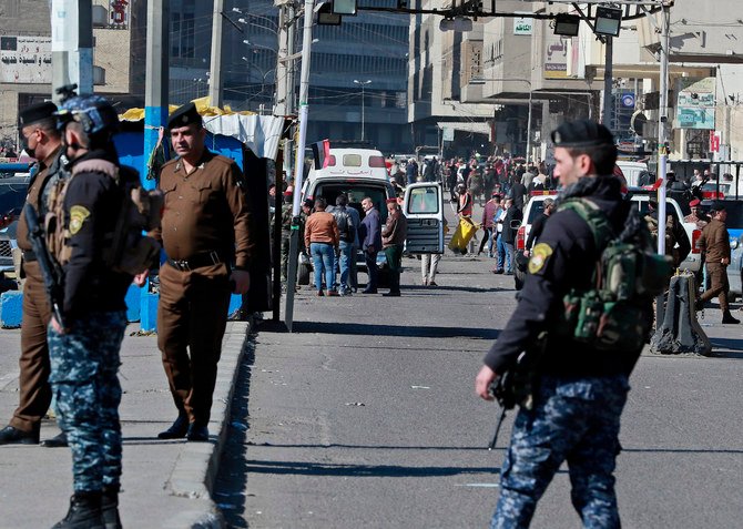 Security forces work at the site of a deadly bomb attack in Baghdad, Iraq, Thursday, Jan. 21, 2021. (AP)