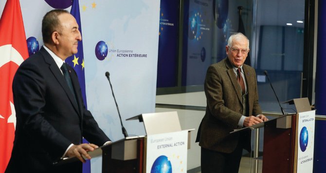 EU foreign policy chief Josep Borrell, right, with Turkey’s Foreign Minister Mevlut Cavusoglu in Brussels on Thursday. (AP)