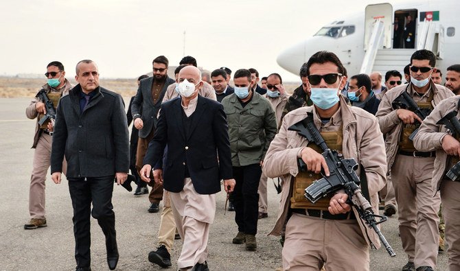 Afghan President Ashraf Ghani (C) arrives with the government delegation during a visit in Herat province on January 21, 2021. (AFP)