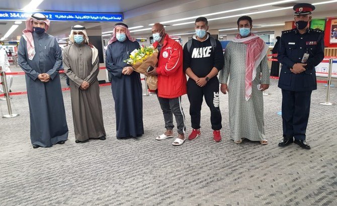 Bodybuilding champion Sami Al-Haddad, his friend Mohammed Al-Dossari and fisherman Habib Abbas arrived at Bahrain International Airport on Jan. 15, 2021 following their release from detention by Qatar. (BNA)