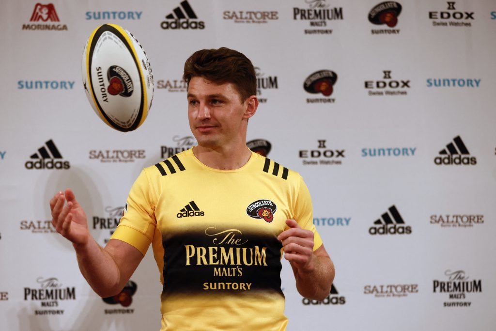 New Zealand rugby union player Beauden Barrett, a new recruit of Japan’s Suntory Sungoliath, plays with a ball as he wears his new jersey during a photo session in Tokyo on January 6, 2021. (AFP)