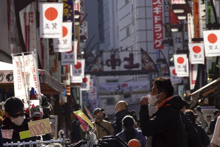 People stroll at a shopping street on Sunday, Jan. 3, 2021, in Tokyo. (AP)