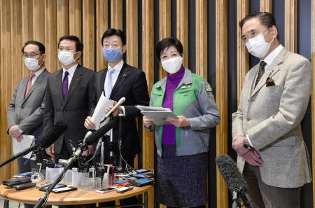 Japan's Saitama Governor Motohiro Ono, Chiba Governor Kensaku Morita, Economy Minister and minister in charge of coronavirus response Yasutoshi Nishimura, Tokyo Governor Yuriko Koike and Kanagawa Governor Yuji Kuroiwa attend a joint news conference after their meeting in Tokyo, Japan, January 2, 2021, in this photo taken by Kyodo. (Kyodo/via Reuters)