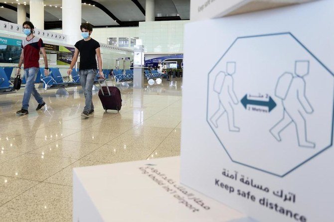 Travelers wearing protective face masks walk at Riyadh International Airport, after Saudi Arabia reopened domestic flights in Riyadh, Saudi Arabia. (Reuters/file)