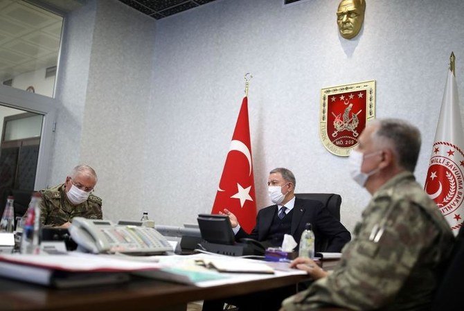 Turkish Minister of Defense Hulusi Akar (center) at Army Command Control Center in Ankara during the military operation dubbed Claw-Tiger against PKK elements in Iraqi Kurdistan, June 17, 2020. (AFP)
